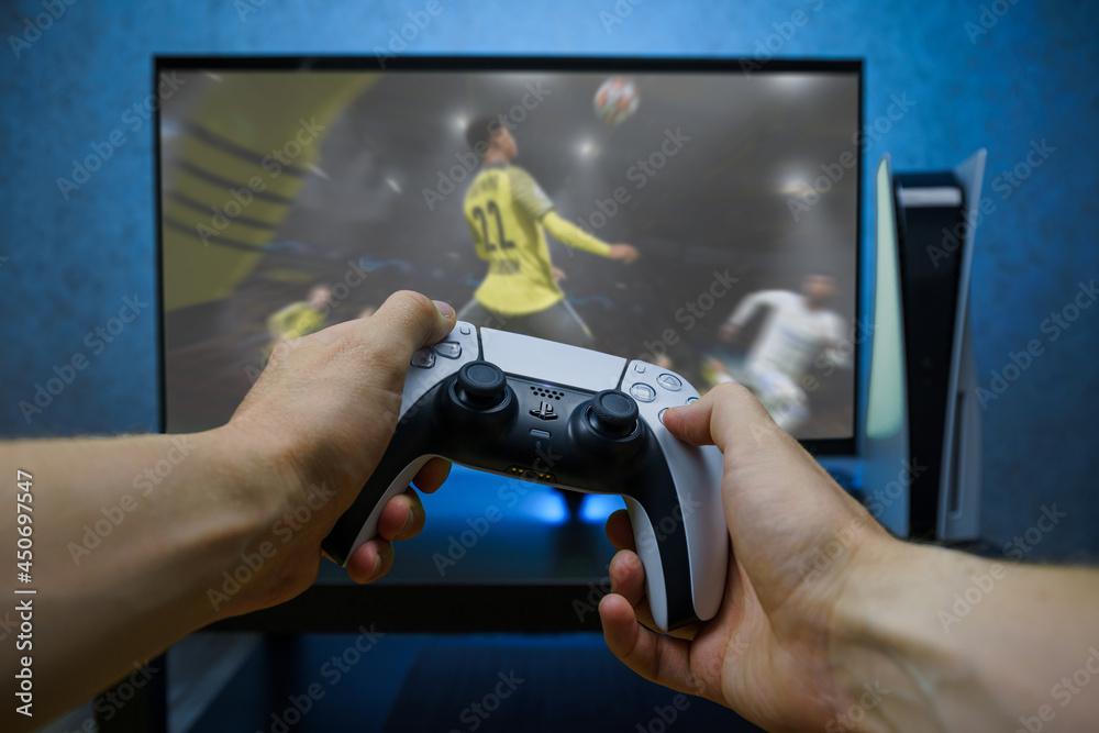 FIFA 2021 football video game on new generation Sony Playstation 5 video  console. Point of view shot. Stock Photo | Adobe Stock