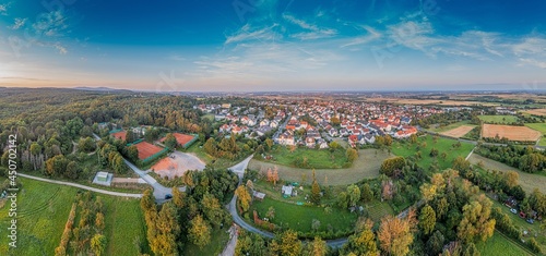 Drone panorama over German southern Hessian settlement Diedenbergen near Wiesbaden in evening light