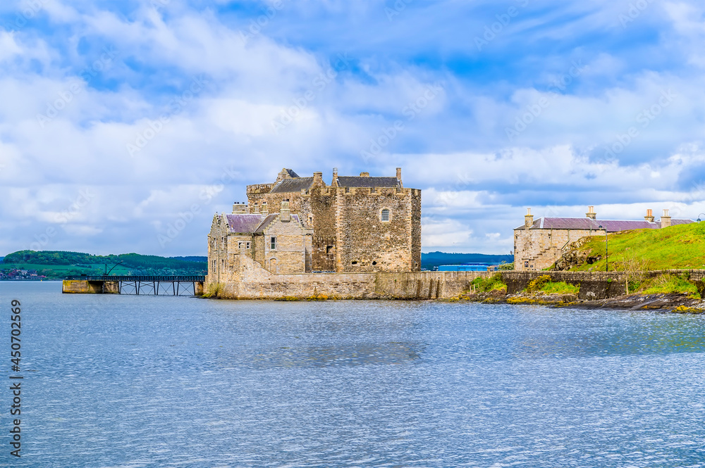 A view across Blackness Bay towards Blackness castle, Scotland on a summers day