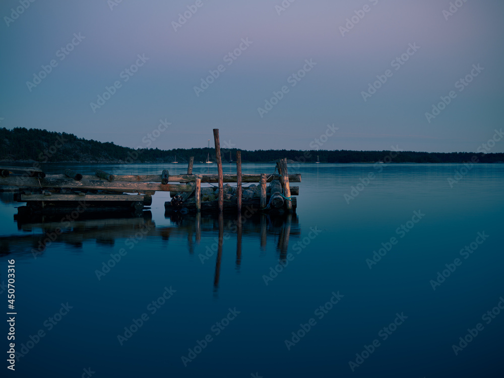 A old broken jetty by the lake at night