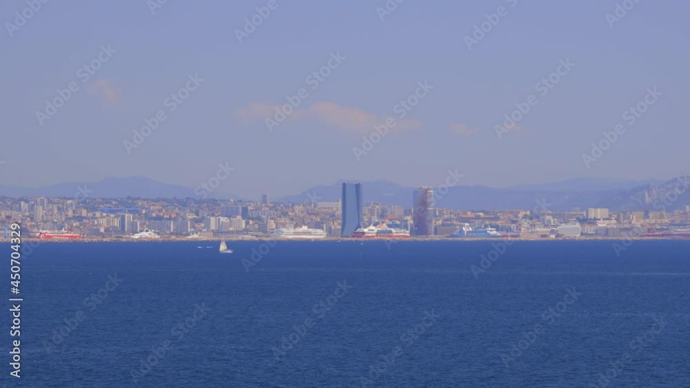Boats sailing on the Mediterranean Sea with a view of the great seaport of Marseille in the background Boats sailing on the Mediterranean Sea with a view of the great seaport of Marseille in the background