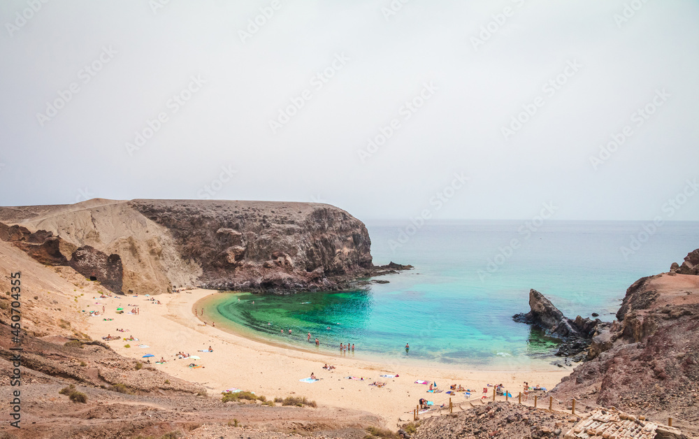 Landscape with turquoise ocean water on Papagayo beach, Lanzarote, Canary Islands, Spain