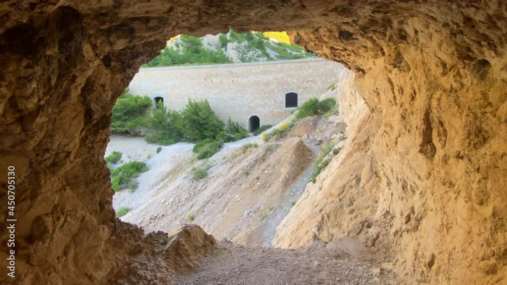 Inside of a limestone tunnel on the Coastal path between Nolion and ...