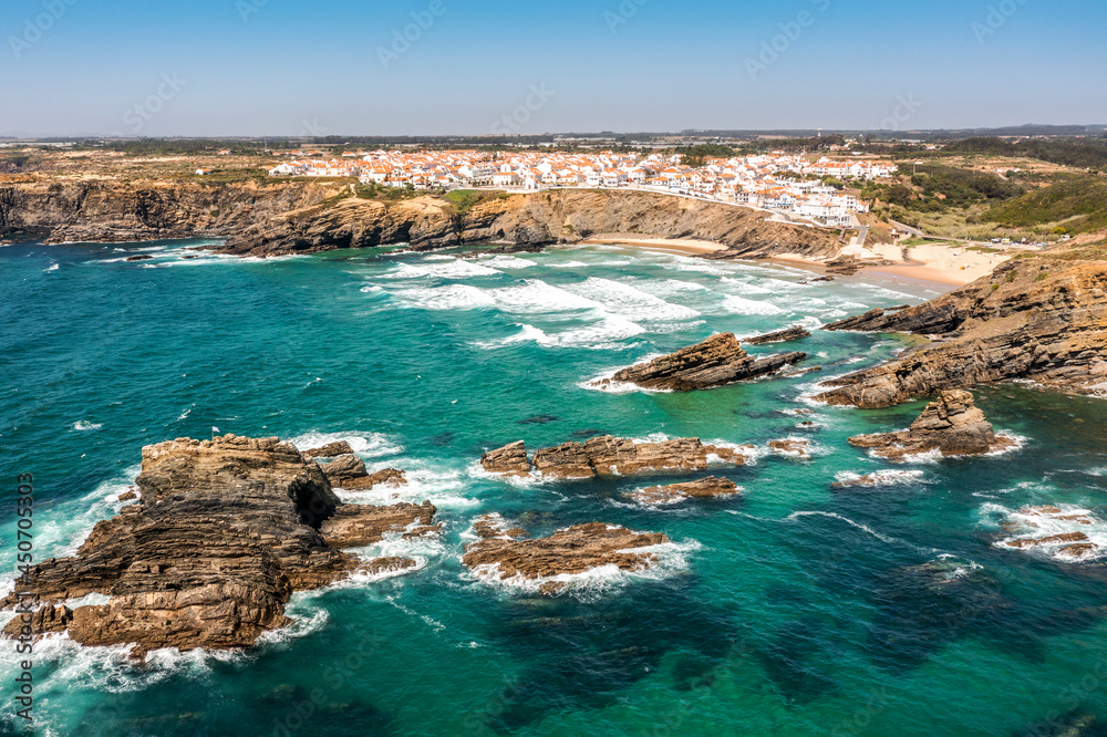 Obraz premium Aerial view of Zambujeira do Mar - charming town on cliffs by the Atlantic Ocean in Portugal