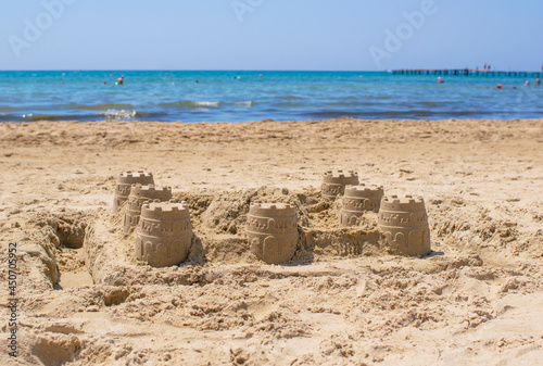 Sandcastle on the sea in summertime