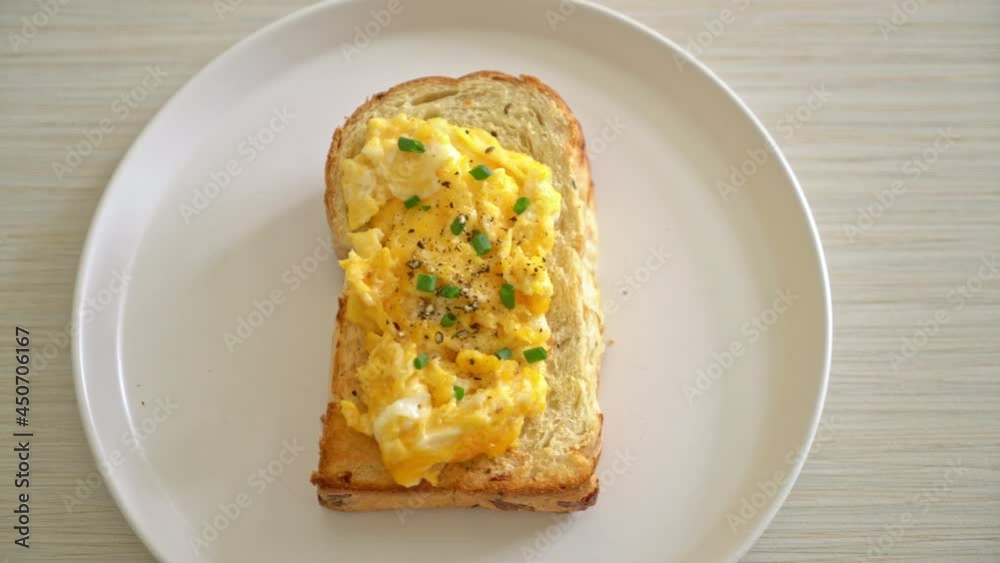 bread toast with scramble egg on white plate bread toast with scramble egg on white plate