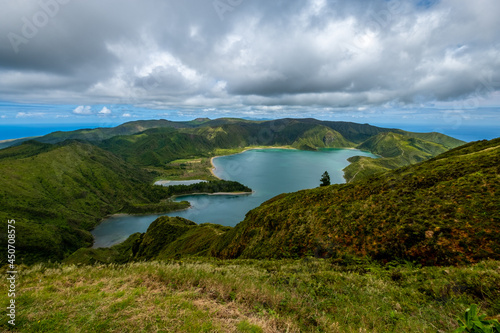 Spetacular view over the landscape on Lagoa do Fogo - "Fire Lake" on a Dramatic Cloudy Day but beautiful colors of the Lagoon. São Miguel Island in the Azores, Portugal.