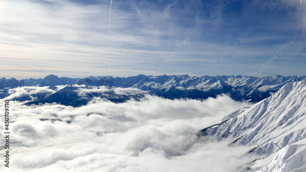 a view from the Nordkette mountain of Innsbruck, which is obscured by fog and clouds. Austria, Alps a view from the Nordkette mountain of Innsbruck, which is obscured by fog and clouds. Austria, Alps
