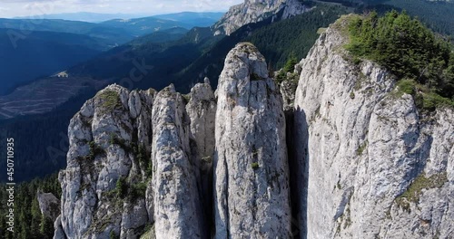 Close Up View Of The Lonely Rock Jagged Cliffs At Piatra Singuratica In Hasmasul Mare, Romania. - aerial drone photo