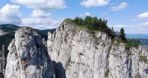 Sandstone And Limestone Massif Of Hasmas Mountains In The Romanian Carpathian Mountain Range Near Piatra Singuratica In Romania. close up orbit photo