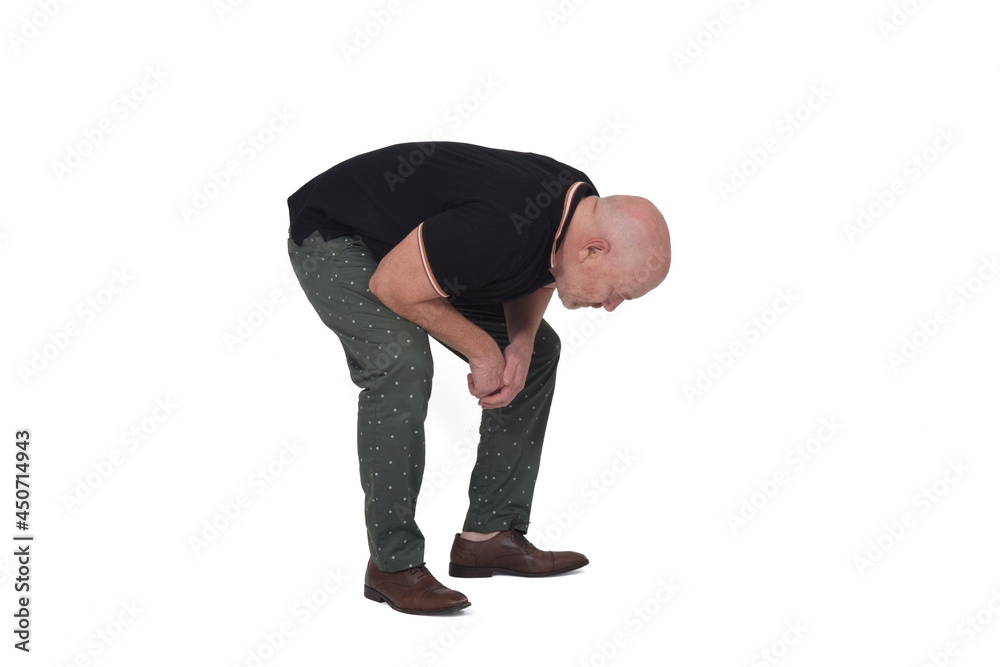 Naklejka premium man crouching and searching the floor on white background