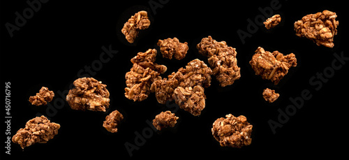 Photography Chocolate granola, crunchy muesli on black background