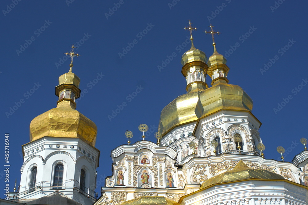 church with golden domes on sky background 