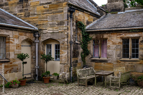 sandstone buildings satding on cobbled courtyard © J-F Phillips
