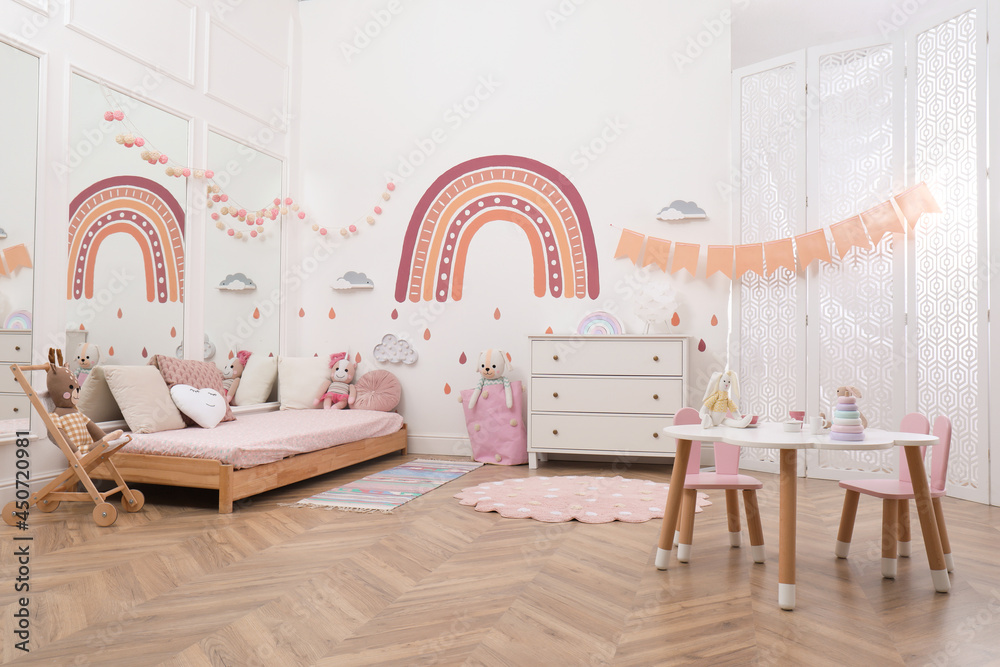 Montessori bedroom interior with floor bed and toys