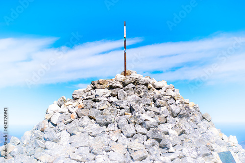 Maclear's Beacon on top of Table Mountain against bright blue sky