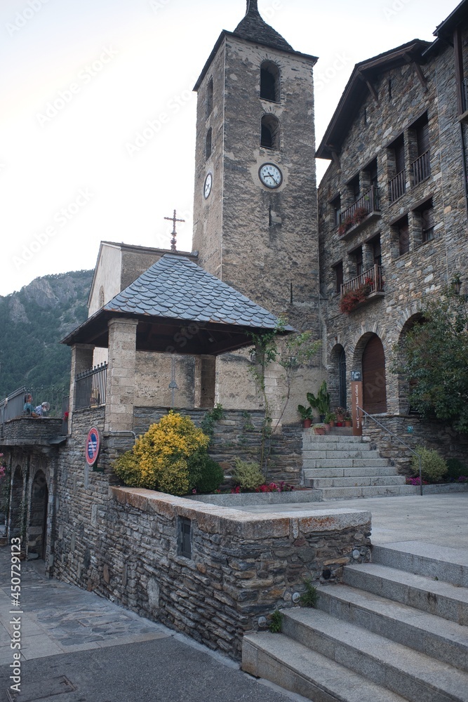 Old door of a small town in the Pyrenees of Andorra. Mountain architecture. Rock, stone and wood