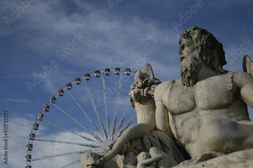 Statue and Ferris wheel