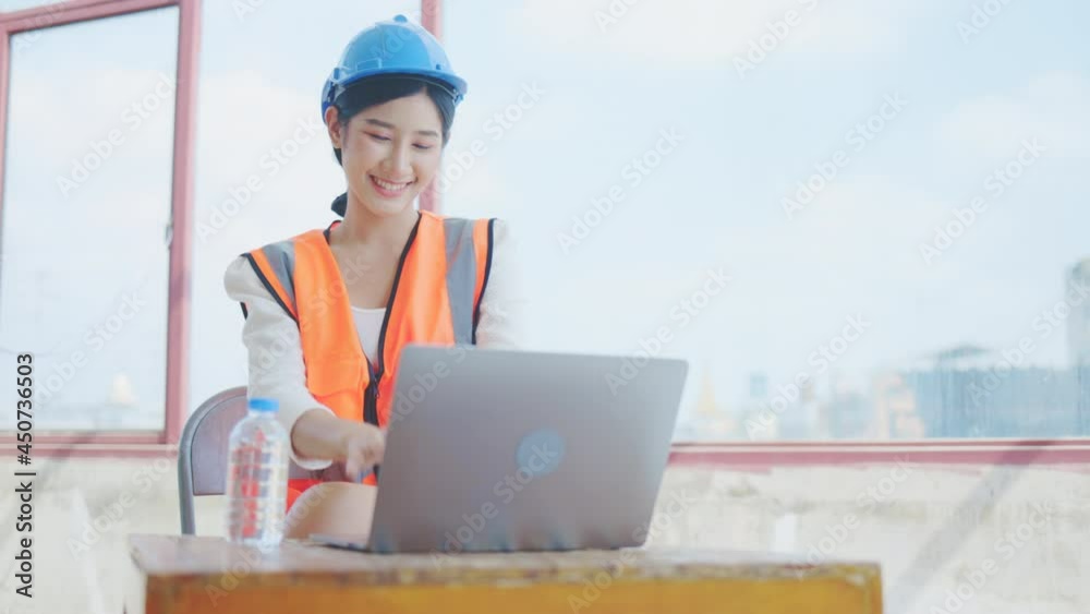 Asian woman civil engineer active meeting webinar with team. Present construction work via video call with confidence successful work. distance coordination. Control construction with technology Asian woman civil engineer active meeting webinar with team. Present construction work via video call with confidence successful work. distance coordination. Control construction with technology