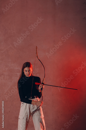 Archer woman with sport bow and arrow.