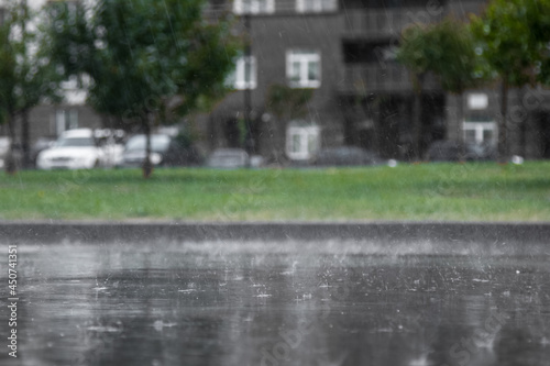 Heavy rain, close-up of splashing and flying drops with an inver