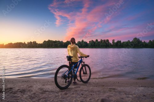 Woman with mountain bike on...