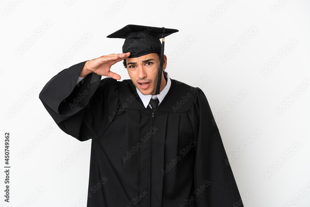 Young university graduate over isolated white background looking far away with hand to look something Young university graduate over isolated white background looking far away with hand to look something
