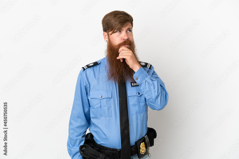 Redhead police man isolated on white background having doubts and with confuse face expression Redhead police man isolated on white background having doubts and with confuse face expression