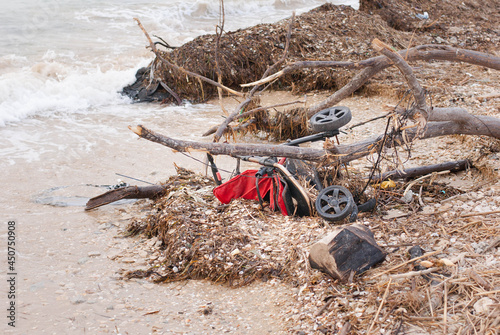 Schilderij op canvas Filthy beach on the Mediterranean Sea in Israel, plastic boths, stroller, dead f