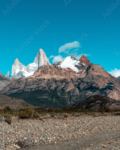 View of mount fitz roy at the edge of the stone road