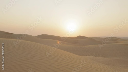 sun sen in the desert dunes and sand in the dusk