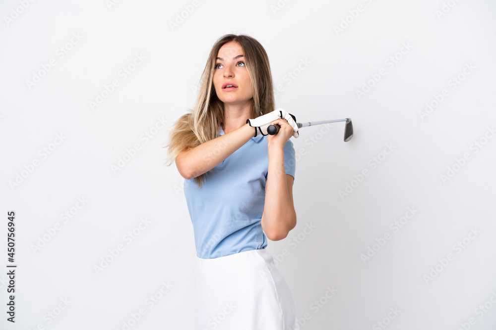 Young Romanian woman isolated on white background playing golf Young Romanian woman isolated on white background playing golf