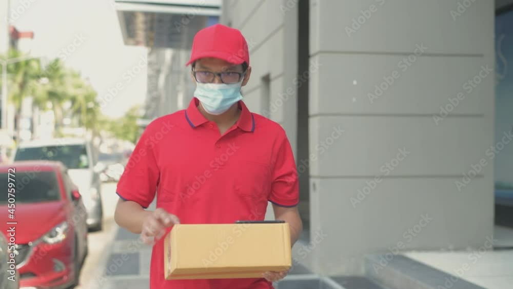 Business concept of 4k Resolution. The courier was talking on the phone to communicate with customers. Business concept of 4k Resolution. The courier was talking on the phone to communicate with customers.