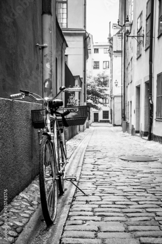 Street with bicycle by the wall