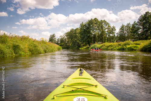 people kayaking on the Narew river in Podlasie, father and son, joint activity, two people, group rafting