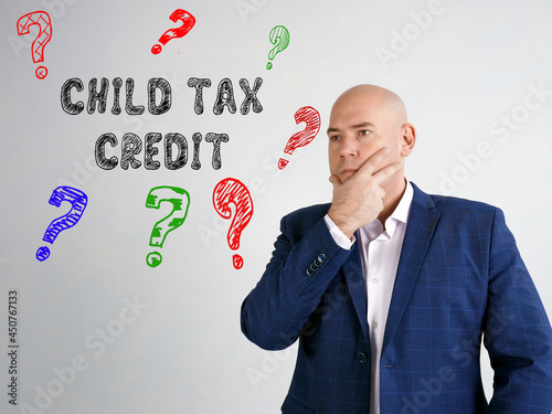 Fotografia, Obraz Financial concept meaning CHILD TAX CREDIT question marks with phrase on the wal