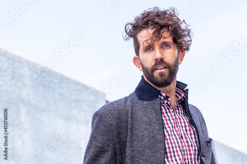 Portrait of model man with curly hair.