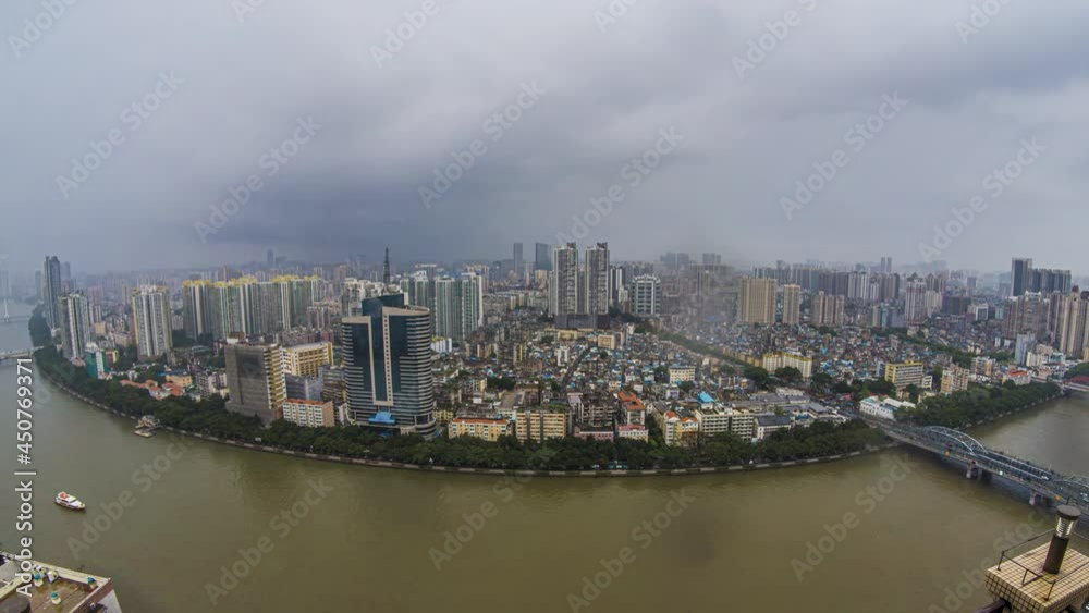 Ultra wide day to night transition time lapse. Huge mega city rain and nightfall timelapse. Evening clouds over major Chinese city with river. Ultra wide day to night transition time lapse. Huge mega city rain and nightfall timelapse. Evening clouds over major Chinese city with river.