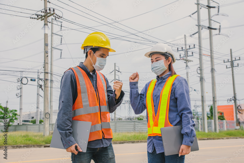 Team work engineer wear face mask out side working inspection or survey Team work engineer wear face mask out side working inspection or survey