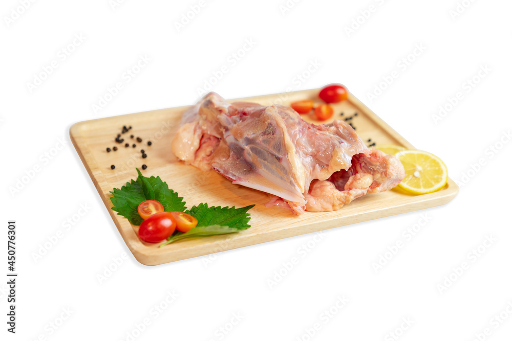 Chicken ribs and spices paste on wooden cutting board.