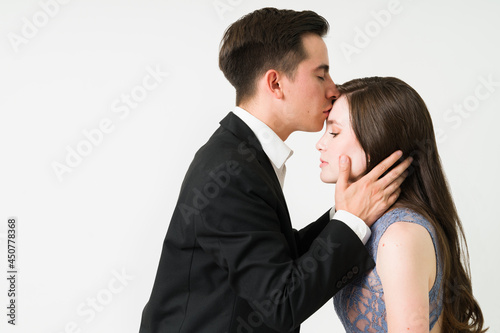 Charming boyfriend giving a kiss to his girlfriend
