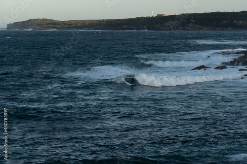 male surfer in action on a wave in a remote island location