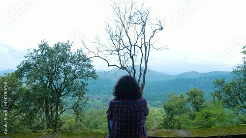 silhouette of a person standing on a tree 
in to the nature