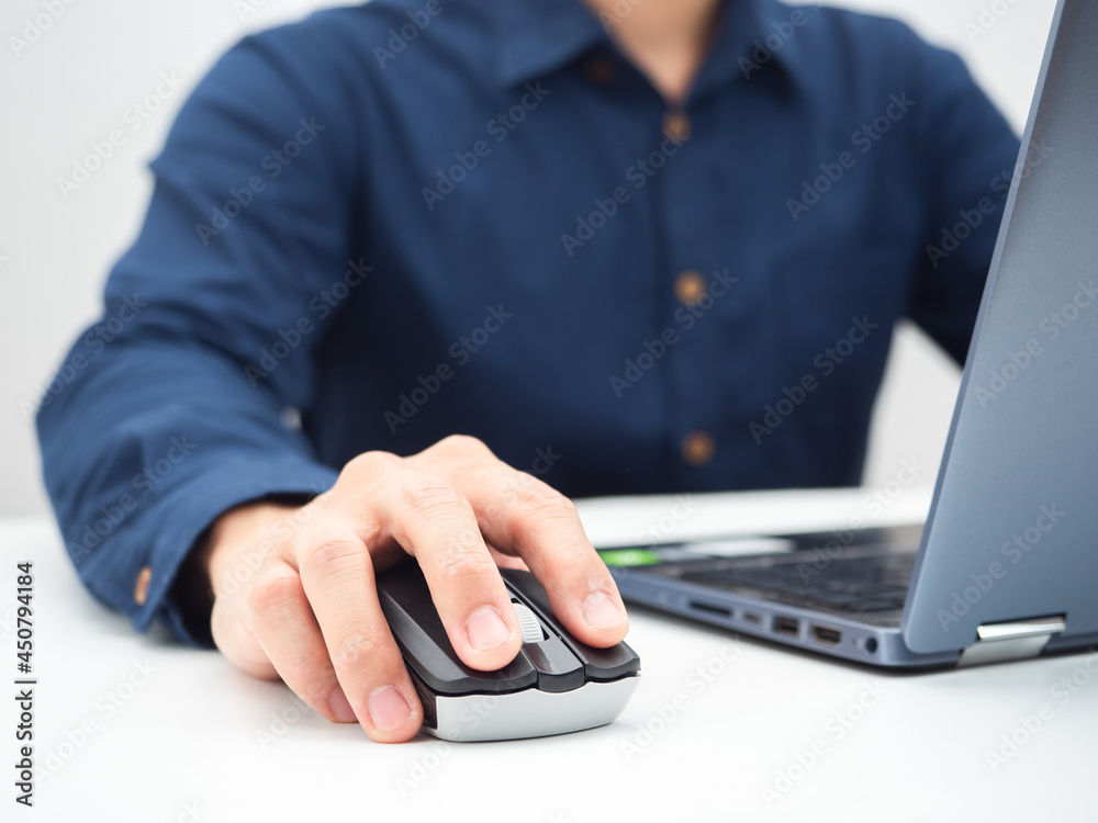 Close up man hand on mouse laptop working from home concept Close up man hand on mouse laptop working from home concept