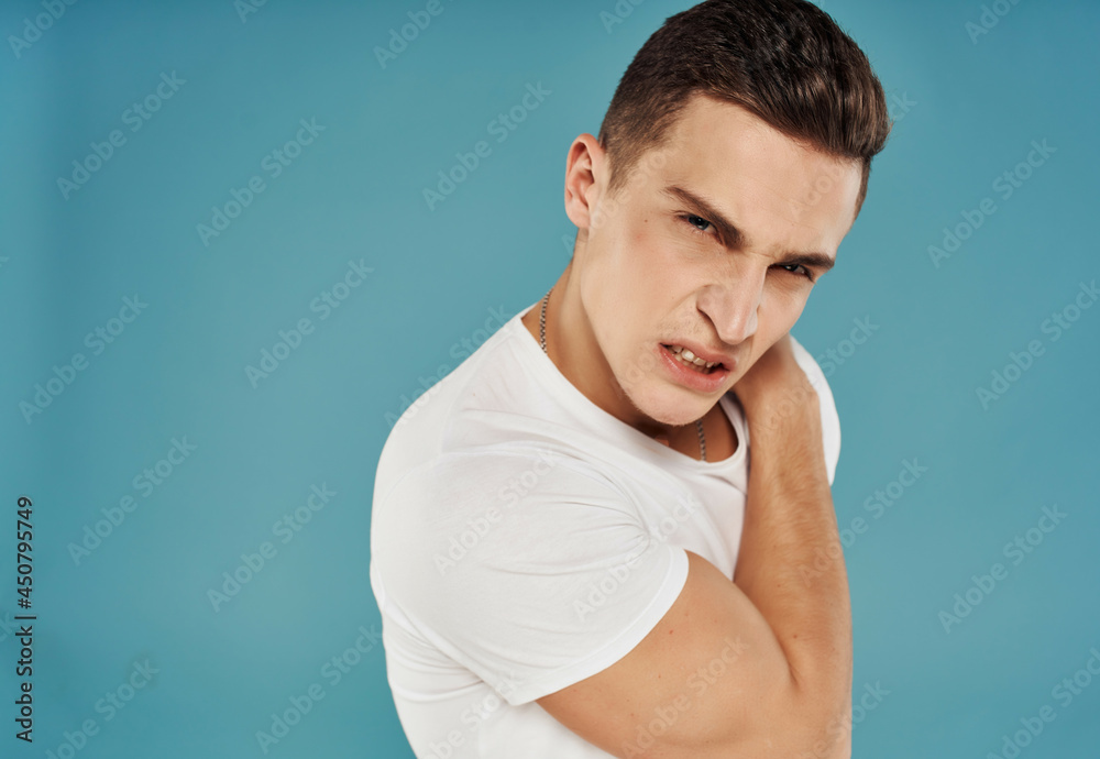 man with serious facial expression emotions close-up blue background man with serious facial expression emotions close-up blue background