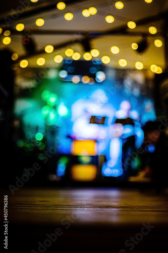 Empty old wooden table in an old restaurant at night as a background