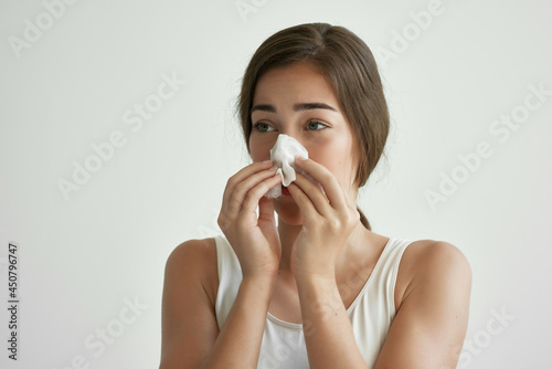 woman in white tank top handkerchief runny nose health problems