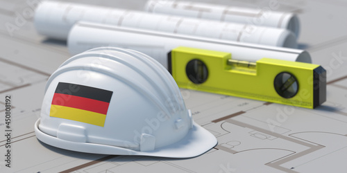 German flag Architect engineer hardhat on project blueprint plans, 3d illustration