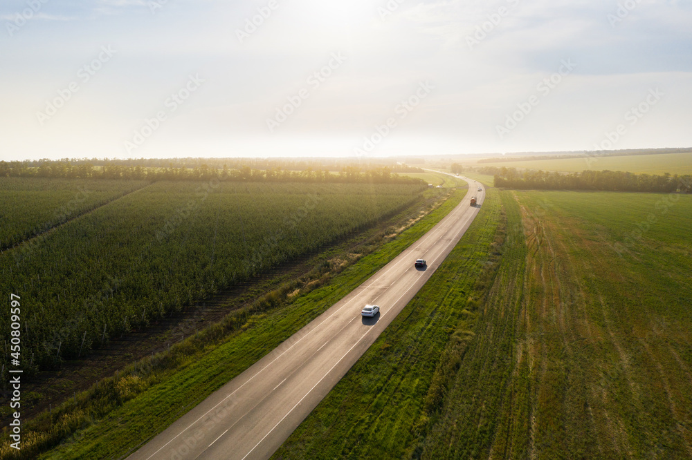 Aerial view of the road through the farmland