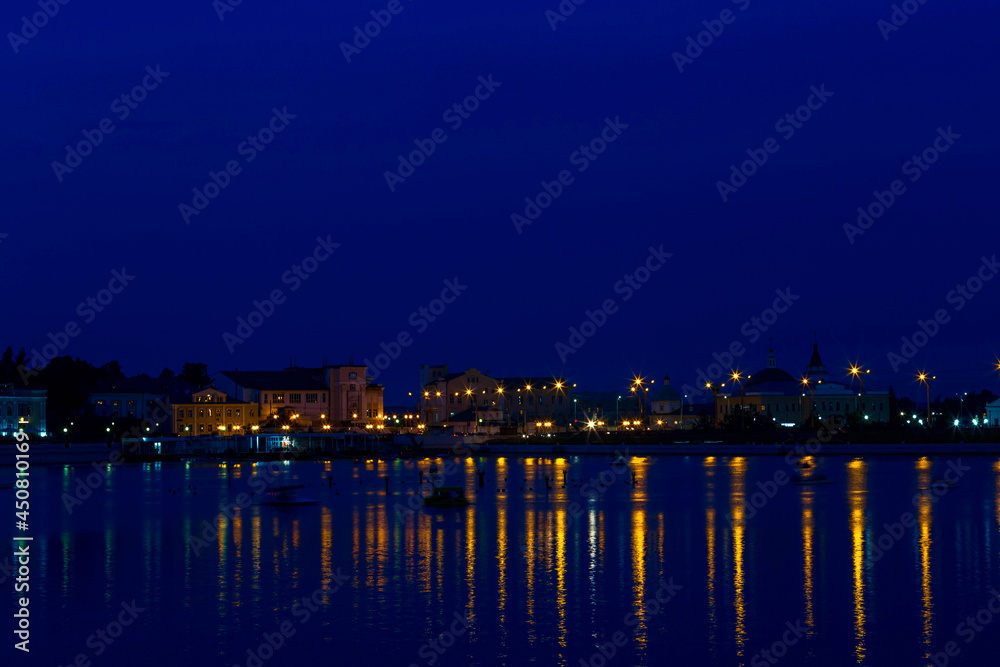 the bay of the city of Cheboksary with reflections of evening lights